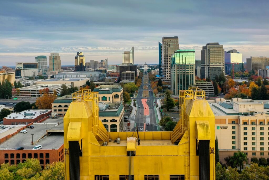 Aerial view from Tower Bridge showcasing Sacramento's modern skyline during fall.