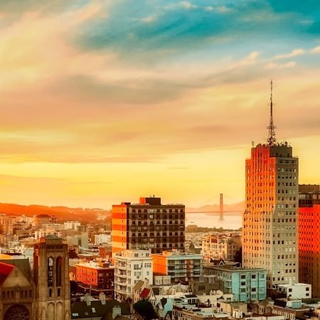 pexels-photo-462331-462331-2 Stunning view of San Francisco cityscape with Golden Gate Bridge at sunset, vibrant urban atmosphere.